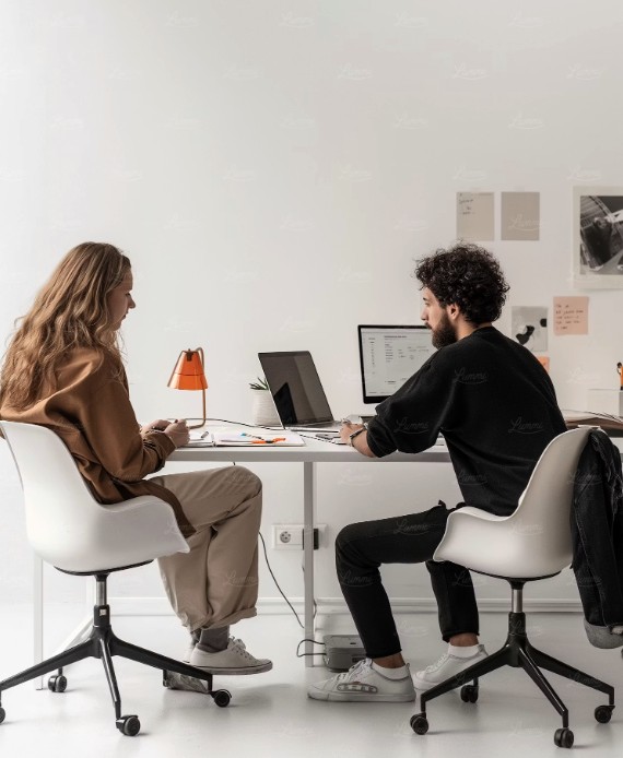 Two Tiance operators working together in a bright office